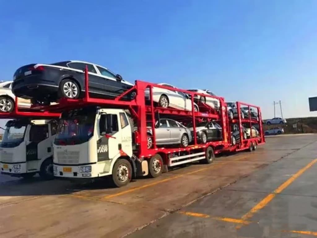 Car carrier trucks heading to port delivery