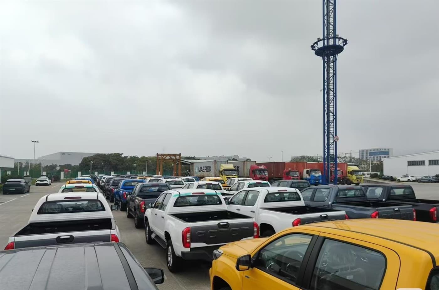 Vehicles parked in a yard awaiting shipment